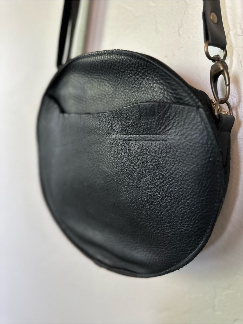 Poppyseeds Black Leather Circle Crossbody Bag with Gold Zipper and Pockets